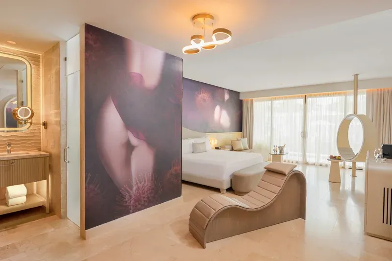 Beloved Tropical-View Swim-Up Suite with open bedroom and sculptural chaise